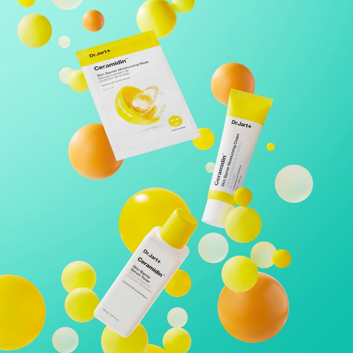 Dr.Jart+ Ceramidin Skin Barrier Moisturizing Cream 15 ml kosteuttava päivävoide keltaisessa tuubissa keltaisten pallojen seassa.