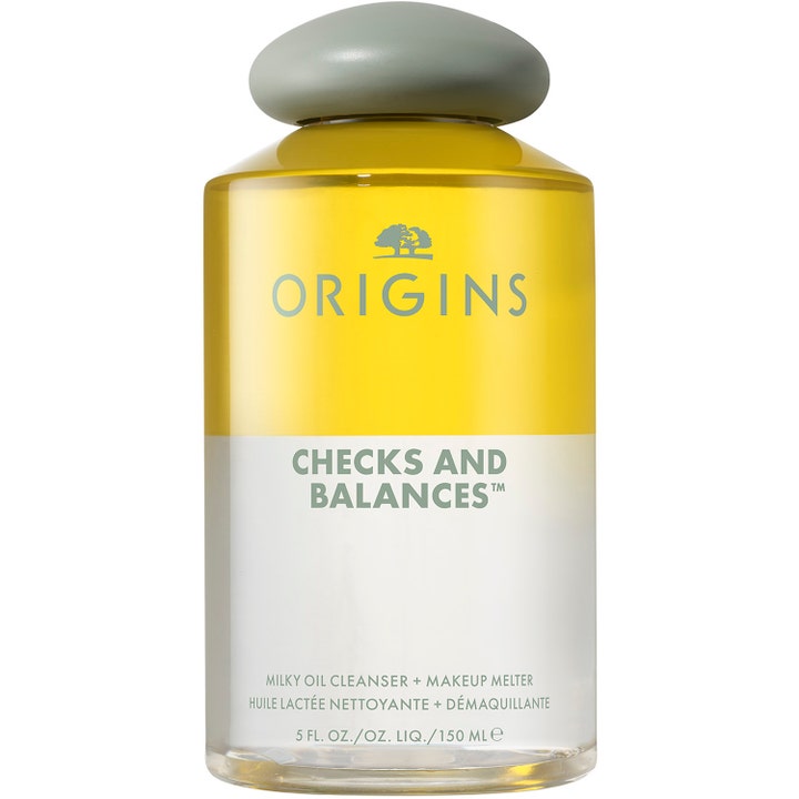 Origins Checks and Balances 150 ml puhdistusöljy poistaa meikkiä kaksifaasisella koostumuksella kirkkaassa pullossa.