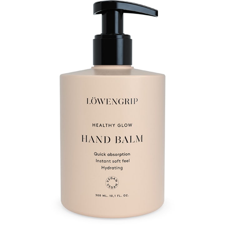 Löwengrip Healthy Glow Hand Balm 300 ml kosteuttava käsivoide beigessä muovipullossa, jossa on musta pumppu.