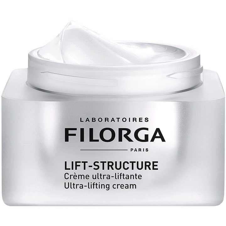 Filorga Lift-Structure Cream 50 ml kiinteyttävä päivävoide avatussa hopeisessa purkissa täyteläisellä valkoisella voiteella.