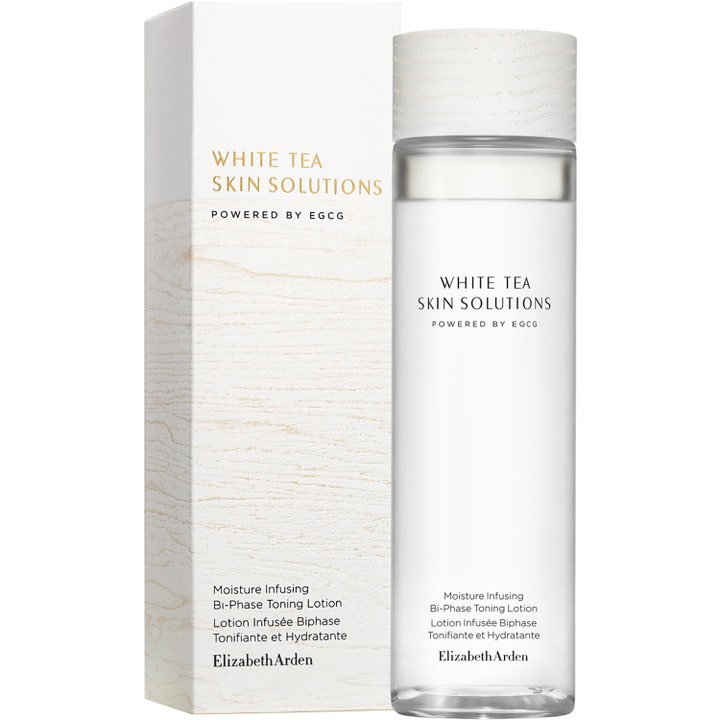 Elizabeth Arden White Tea Skin Solutions 200 ml kosteuttava kasvovesi lasipullossa ja vaaleassa puukuvioidussa pakkauksessa.
