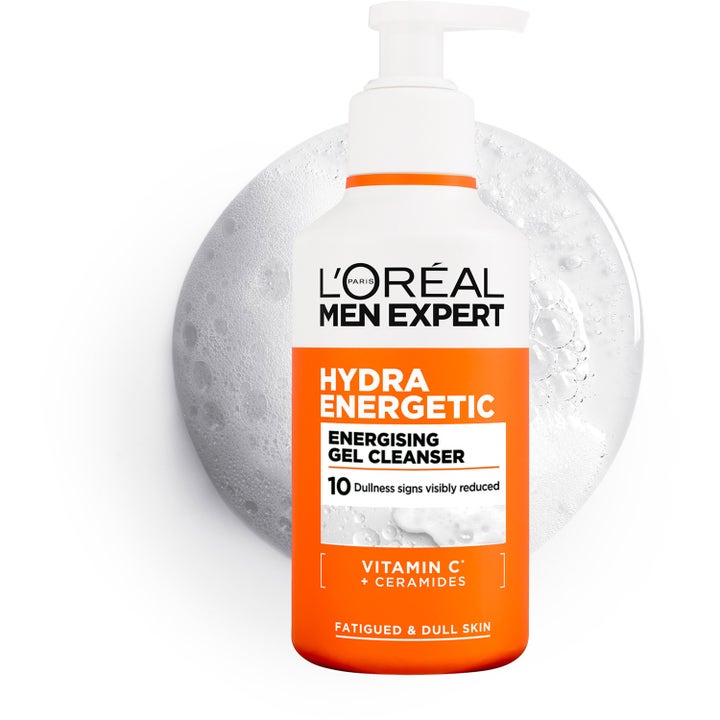 L'Oréal Paris Men Expert Hydra Energetic 260 ml kirkastava puhdistusgeeli oranssissa pumppupullossa ja kupliva geeli.