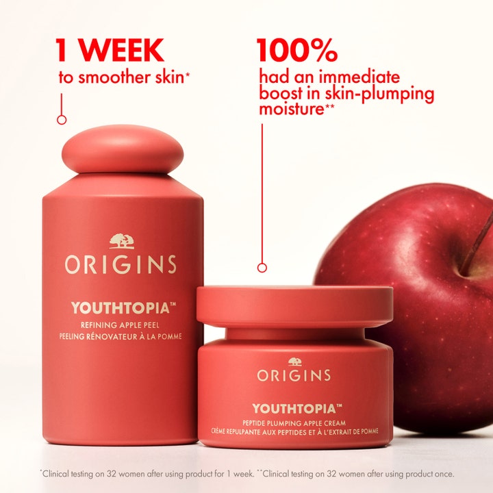 Origins Youthtopia Refining Apple Peel 100 ml ihoa silottava kuorinta-aine punaisessa pullossa omenan kera.
