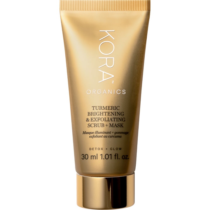 KORA Organics Turmeric Brightening & Exfoliating Scrub + Mask 30 ml heleyttävä kuorintanaamio kultaisessa tuubissa