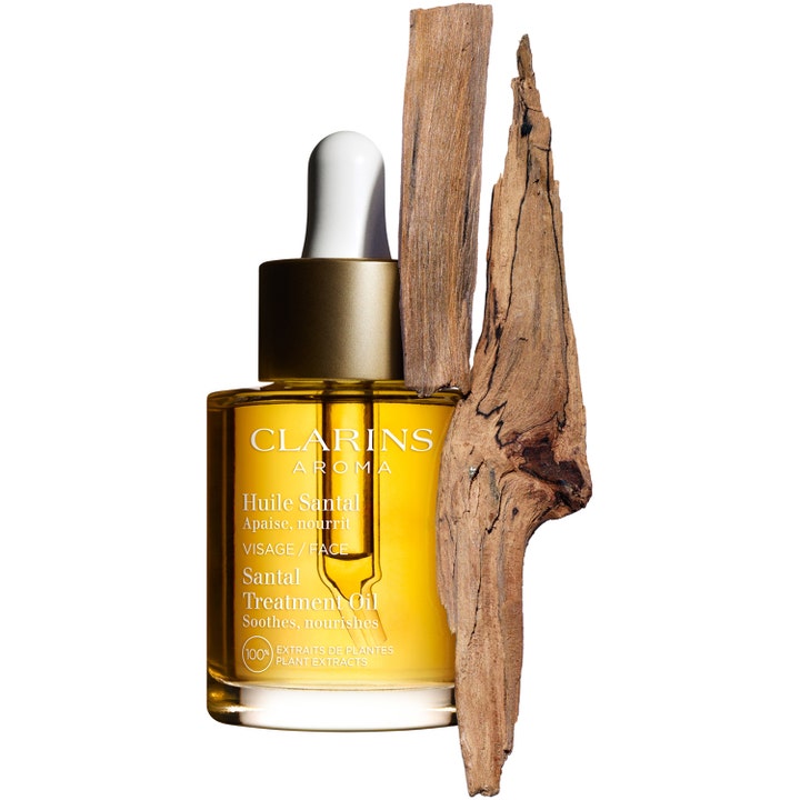 Clarins Santal Face Treatment Oil 30 ml rauhoittava kasvoöljy pipetillisessä lasipullossa santelipuun kera
