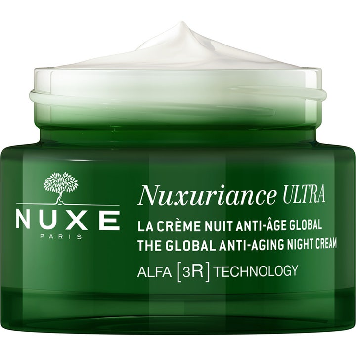 Nuxe Nuxuriance Gold Night Balm 184 g anti-aging yövoide on täyteläinen valkoinen voide vihreässä lasipurkissa.