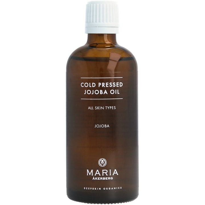 Maria Åkerberg Cold Pressed Jojoba Oil 100 ml kosteuttava kasvoöljy ruskeassa lasipullossa, jossa on valkoinen korkki.