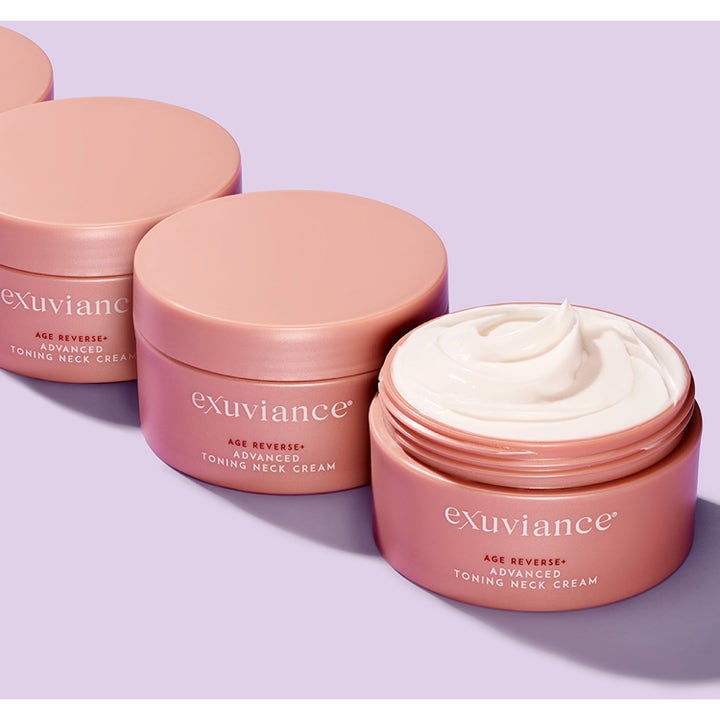 Exuviance Age Reverse Toning Neck Cream 125 g kiinteyttävä kaulavoide vaaleanpunaisessa purkissa valkoisella voiteella