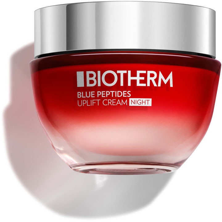 Biotherm Blue Peptides Uplift Cream Night kiinteyttävä yövoide punaisessa liukuvärjätyssä lasipurkissa hopeisella korkilla.