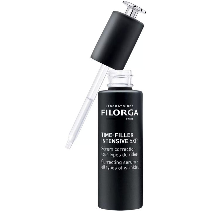 Filorga Time-Filler Intensive 5XP 30 ml juonteita silottava seerumi mustassa pullossa, jossa on lasinen pipetti.