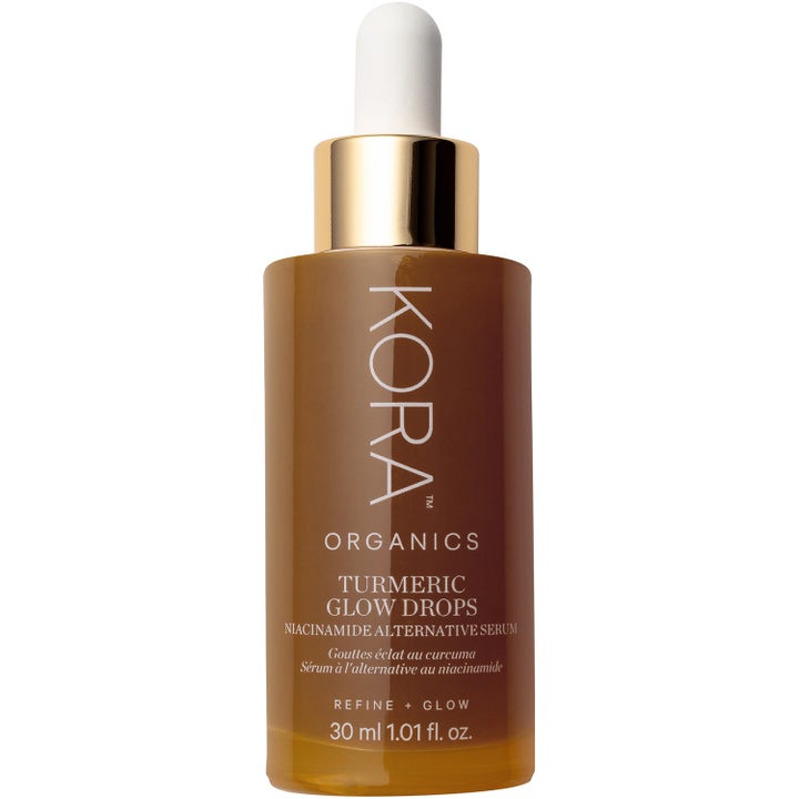 Kora Organics Turmeric Glow Drops 30 ml kirkastava seerumi ruskeassa lasipullossa kultaisella korkilla ja pipetillä