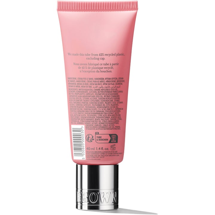 Molton Brown Delicious Rhubarb & Rose Hand Cream 40 ml kosteuttava käsivoide vaaleanpunaisessa tuubissa hopeakorkilla.