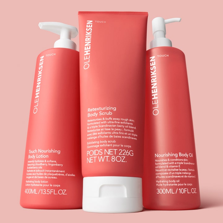 Ole Henriksen TOUCH Nourishing Body Oil 300 ml ravitseva ja kosteuttava vartaloöljy korallinpunaisessa pumppupullossa.