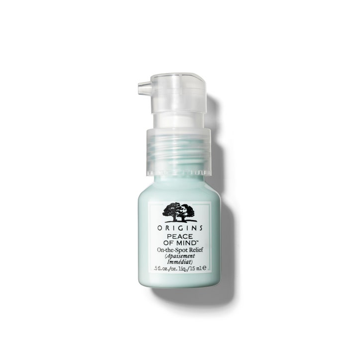 Origins Peace of Mind On-the-Spot Relief 15 ml rauhoittava täsmähoito vaaleansinisessä pullossa kirkkaalla pumpulla.