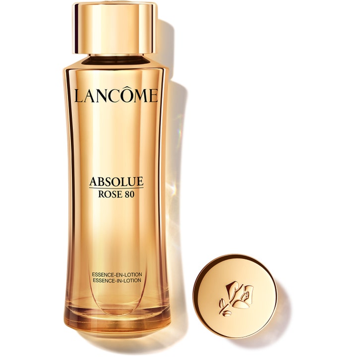 Lancôme Absolue Rose 80 heleyttävä hoitoneste kultaisessa lasipullossa ja irrallinen kultakorkki ruusulogolla.