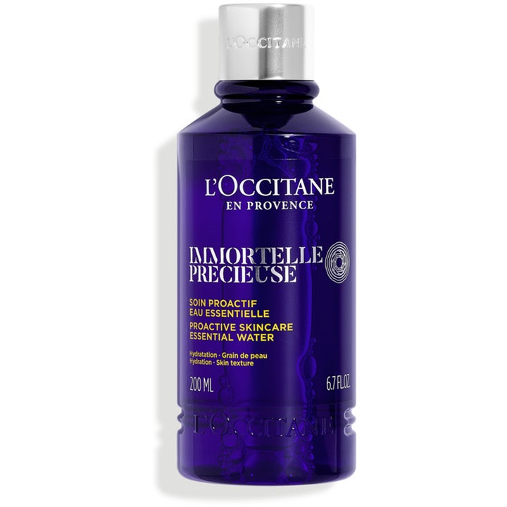 L'Occitane Immortelle Precieuse Essential Water 200 ml kosteuttava kasvovesi tummansinisessä pullossa hopeisella korkilla