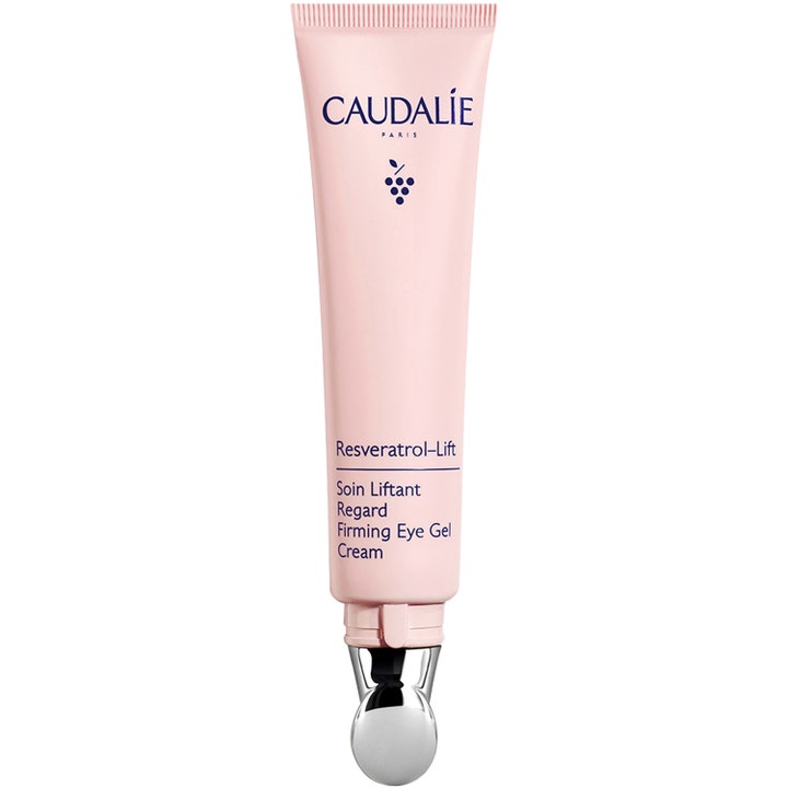 Caudalie Resveratrol-Lift 15 ml kiinteyttävä silmänympärysgeeli vaaleanpunaisessa tuubissa metalliapplikaattorilla.