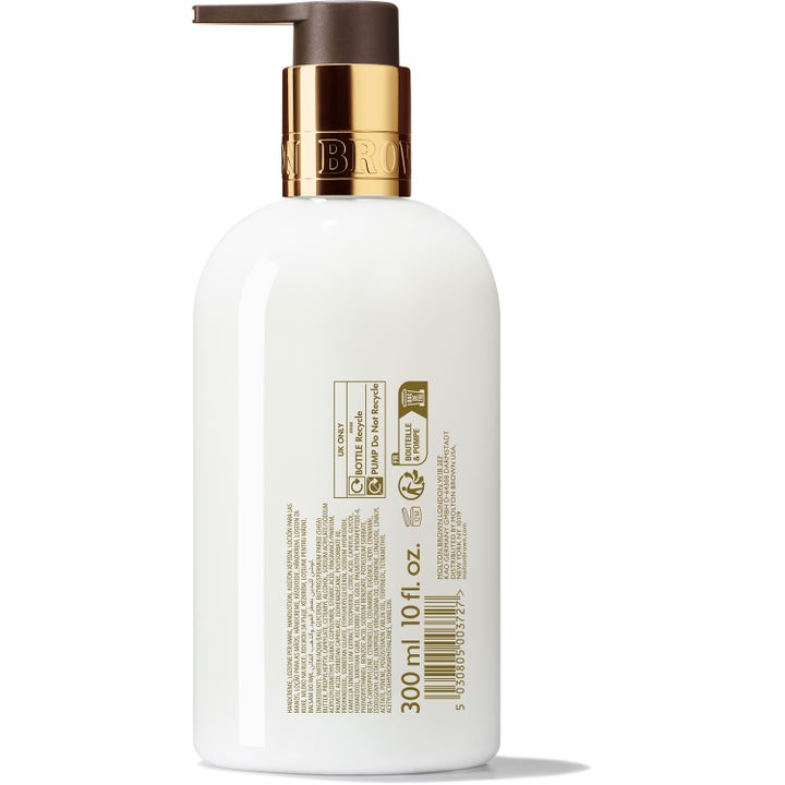 Molton Brown Mesmerising Oudh Accord & Gold 300 ml käsivoide valkoisessa pumppupullossa kultaisella korkilla
