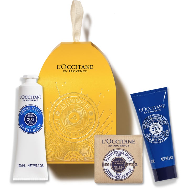 L'Occitane Shea Festive Bauble lahjasetti sisältää kosteuttavan käsi- ja vartalovoiteen sekä palasaippuan keltaisessa pakkauksessa.