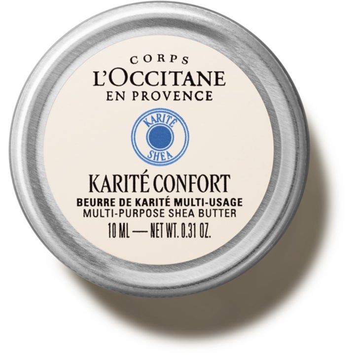 L'Occitane Shea Butter 10 ml ravitseva monitoimivoide pyöreässä hopeanvärisessä metallirasiassa, jossa on vaalea etiketti.