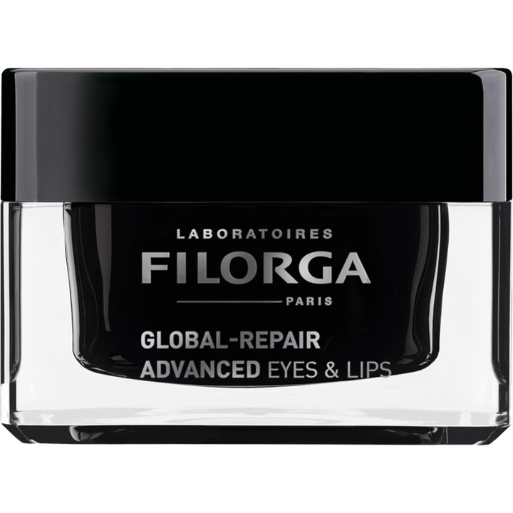 Filorga Global-Repair Advanced Eyes & Lips uudistava silmänympärys- ja huulivoide mustassa ja kirkkaassa lasipurkissa.