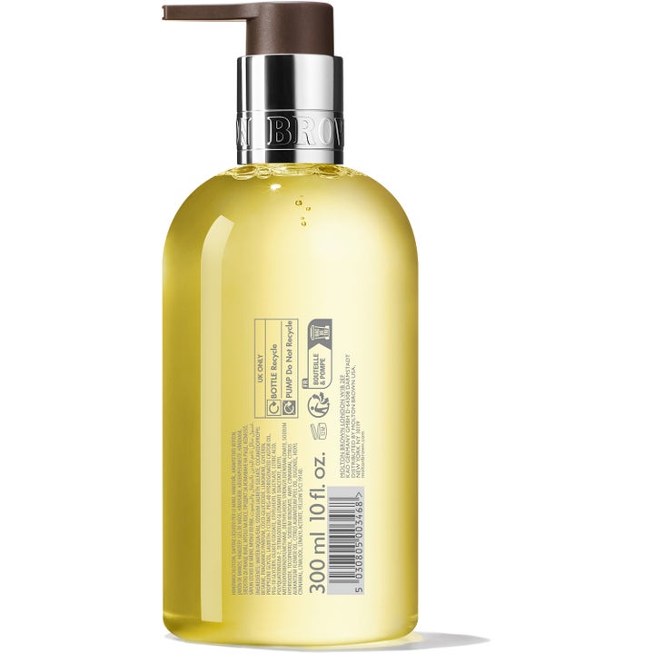 Molton Brown Orange & Bergamot Fine Liquid Hand Wash 300 ml raikastava käsisaippua pullon takapuoli keltaisella nesteellä
