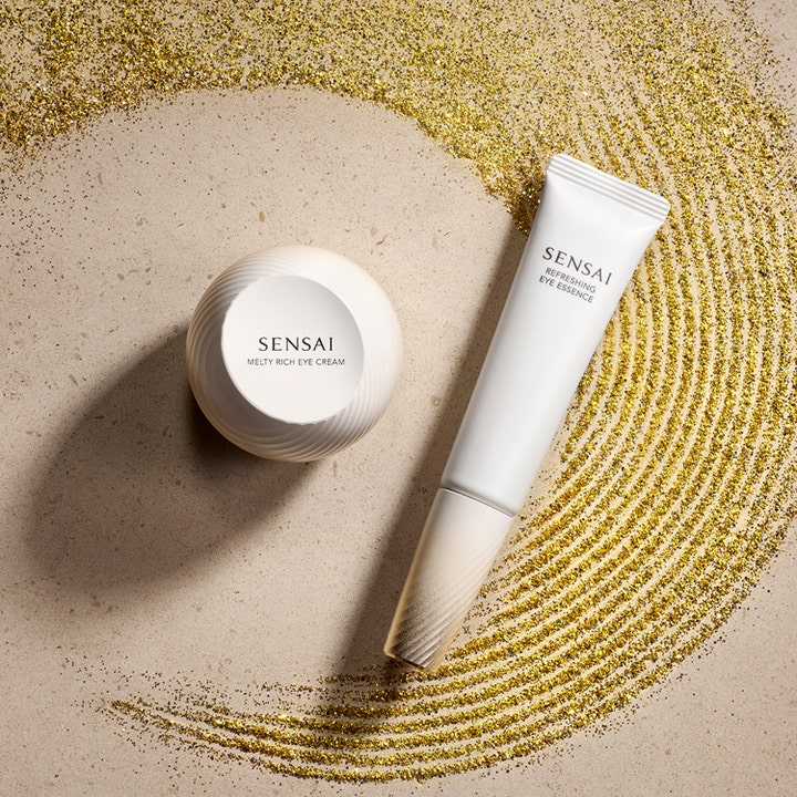 Sensai Refresh Eye Essence 20 ml silmänympärysseerumi valkoinen tuubi ja voidepurkki kultaisella kimalteella