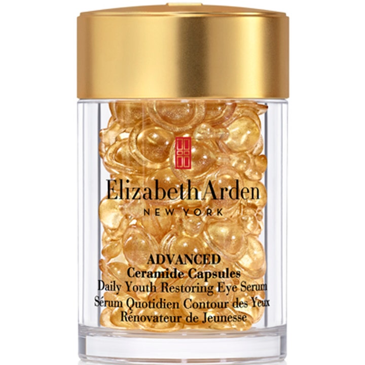 Elizabeth Arden Advanced Ceramide Capsules uudistava silmänympärysseerumi kapseleina kirkkaassa purkissa kultakannella.