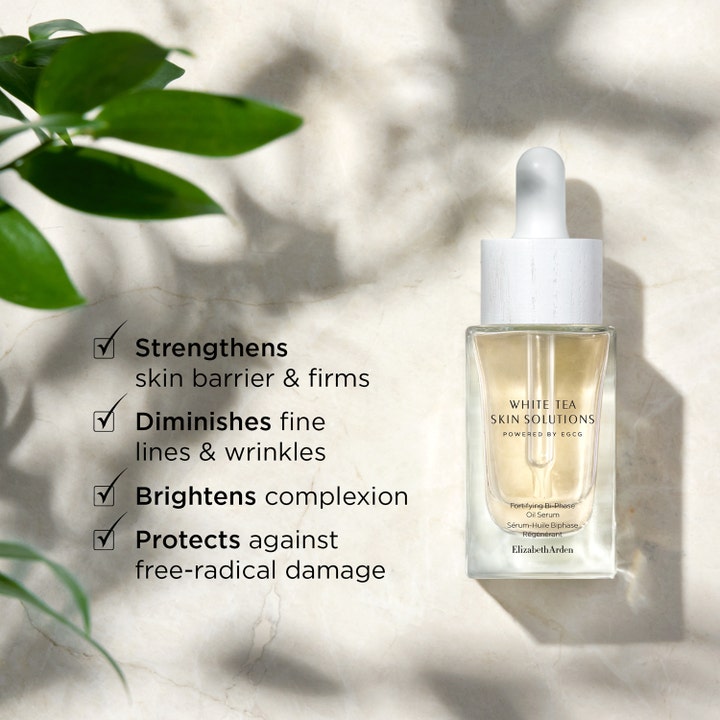 Elizabeth Arden White Tea Skin Bi-phase Oil Serum 30 ml vahvistava seerumi ja kasvoöljy lasipullossa marmoritaustalla.