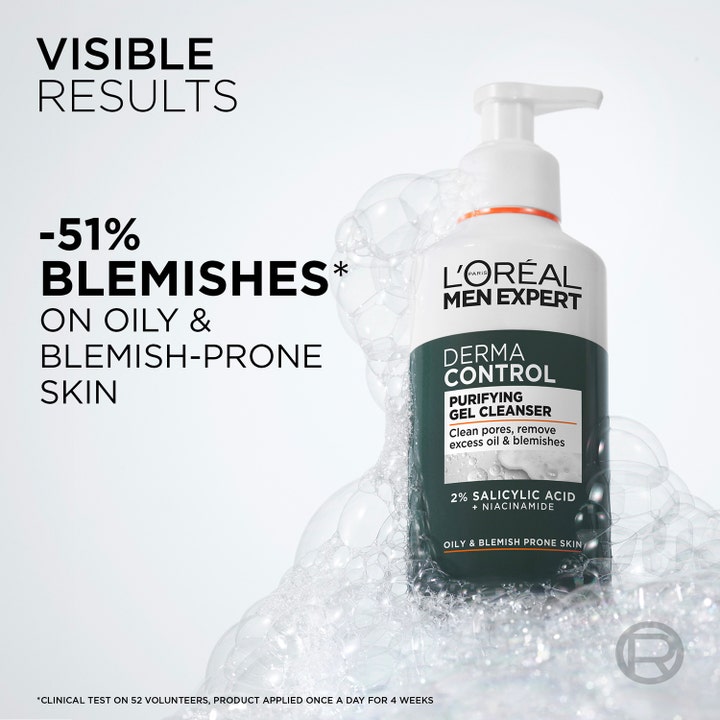 L'Oréal Paris Men Expert Derma Control 260 ml puhdistusgeeli epäpuhtauksille vaahtokuplien ympäröimänä.