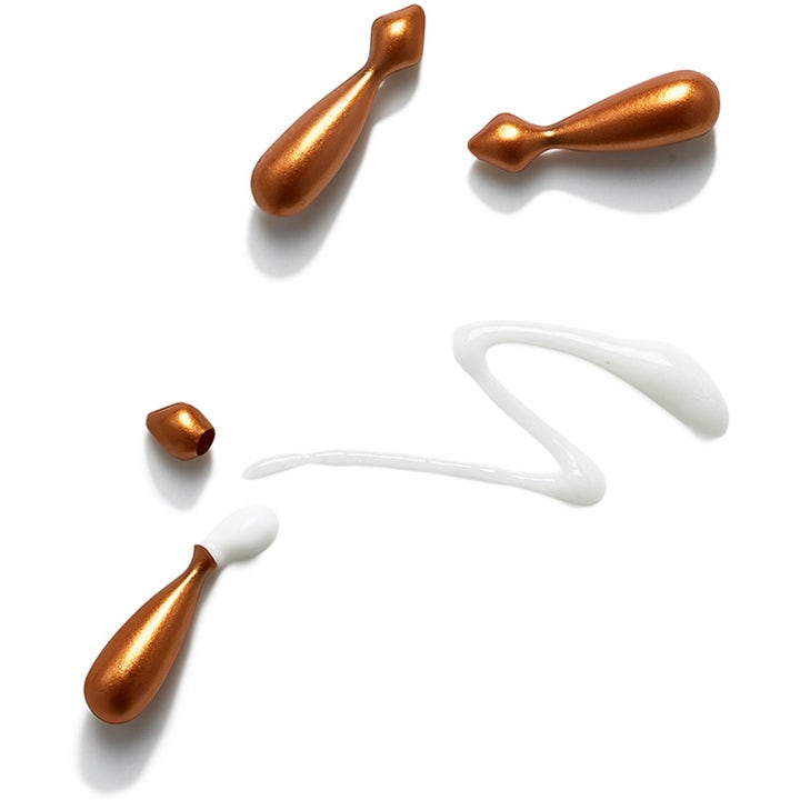 Exuviance Vitamin C Serum Capsules 60 kpl heleyttävä seerumi pronssisina kapseleina ja valkoisena koostumuksena