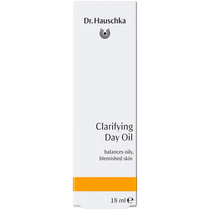 Dr. Hauschka Clarifying Day Oil 18 ml tasapainottava kasvoöljy valkoisessa pakkauksessa oranssilla raidalla.