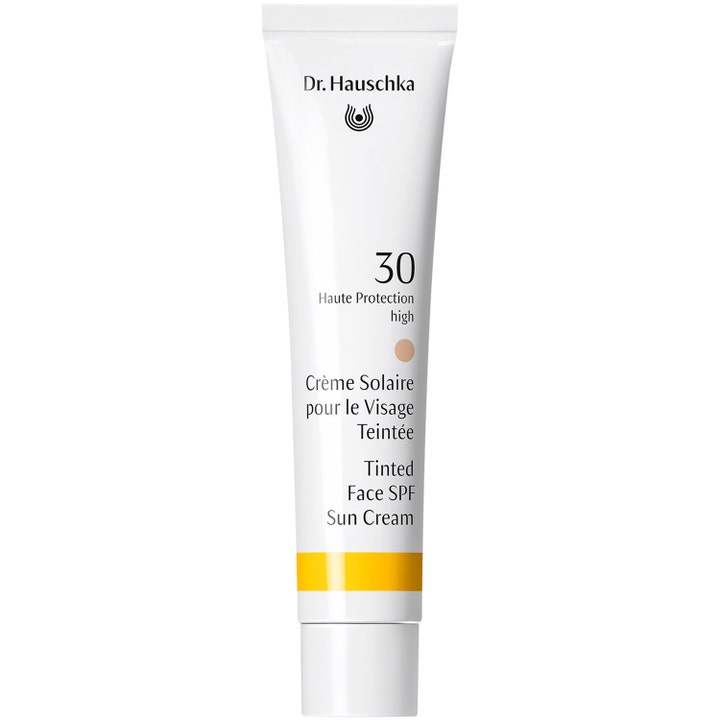 Dr. Hauschka Tinted Face SPF 30 sävytetty aurinkovoide kasvoille valkoisessa tuubissa keltaisella raidalla