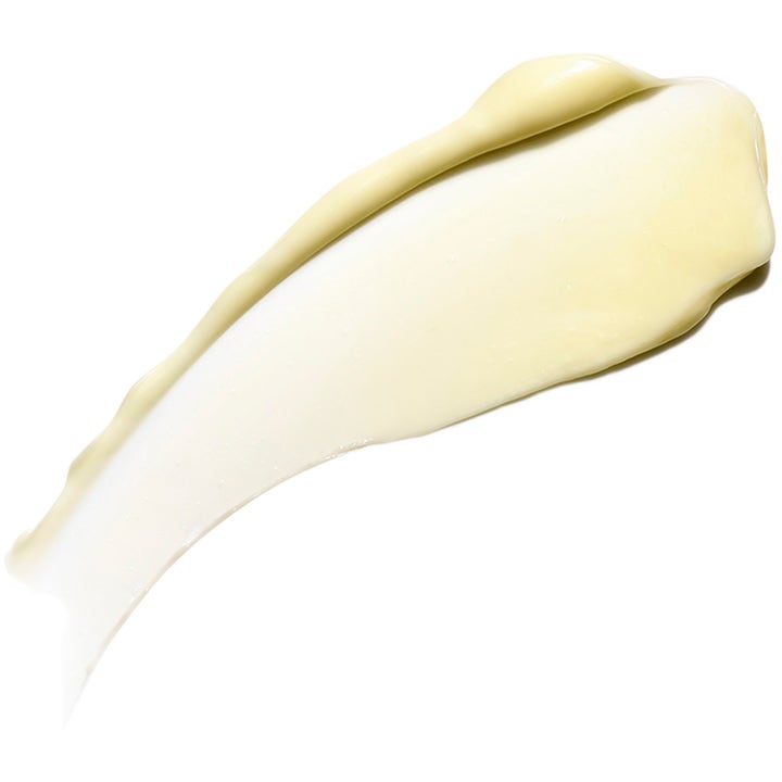 Exuviance Bright Eyes Dark Circle Corrector 15 g silmänympärysvoide tummille silmänalusille vaaleana voidenäytteenä
