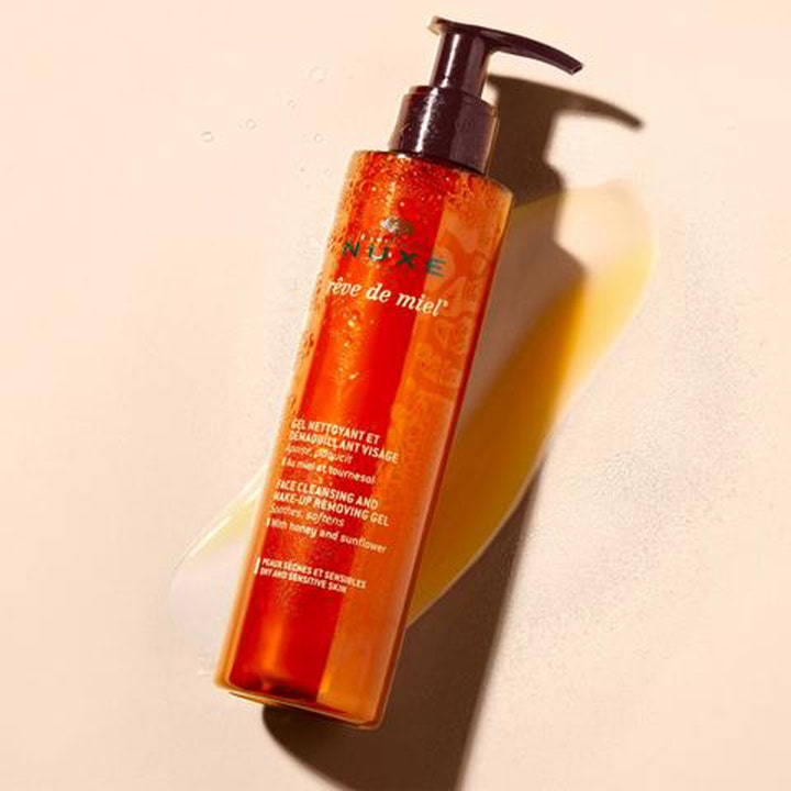 Nuxe Rêve de Miel 200 ml rauhoittava puhdistusgeeli meikinpoistoon oranssissa pullossa hunajaisella koostumuksella.