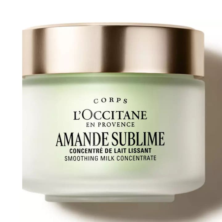 L'Occitane Amande Milk Concentrate 200 ml silottava ja kiinteyttävä vartalovoide hopeakantisessa lasipurkissa