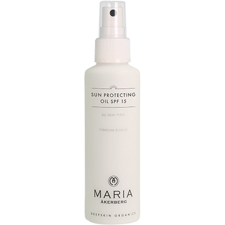 Maria Åkerberg Sun Protecting Oil SPF 15 125 ml suojaava aurinkosuojaöljy valkoisessa suihkepullossa kirkkaalla korkilla.