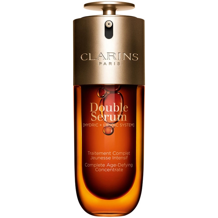 Clarins Double Serum 50 ml kiinteyttävä seerumi kultaisessa pumppupullossa meripihkanvärisellä nesteellä