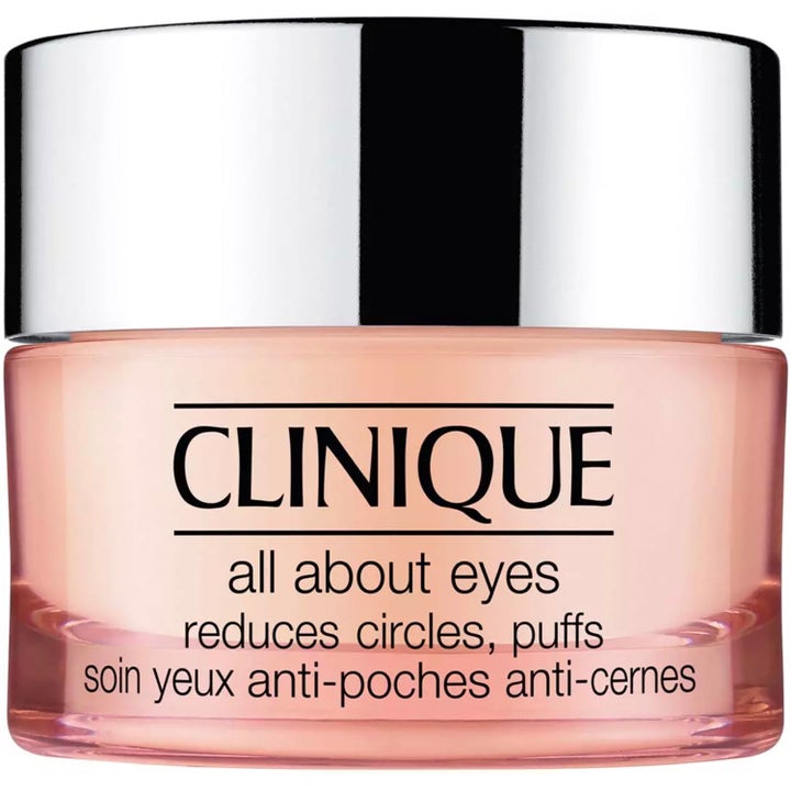 Clinique All About Eyes 15 ml silmänympärysvoide vähentää turvotusta vaaleanpunaisessa purkissa hopeisella korkilla.