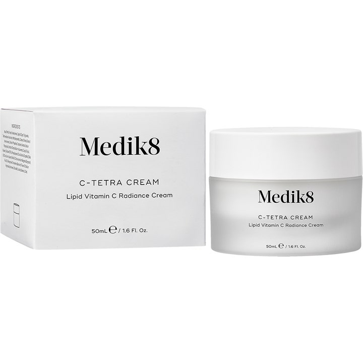 Medik8 C-Tetra Cream 50 ml heleyttävä C-vitamiinivoide huurteisessa lasipurkissa ja valkoisessa rasiassa.
