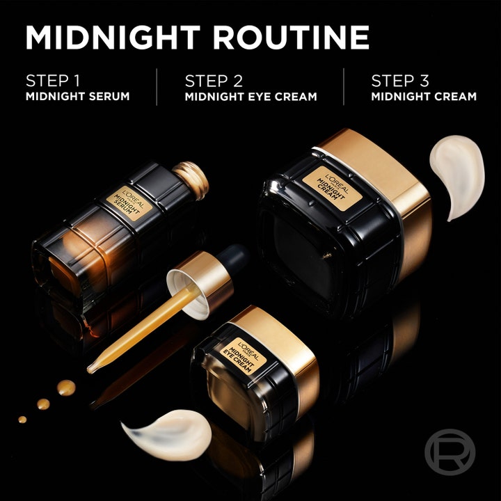 L'Oréal Paris Midnight Eye Cream 15 ml uudistava silmänympärysvoide osana ylellistä rutiinia mustissa ja kultaisissa purkeissa.