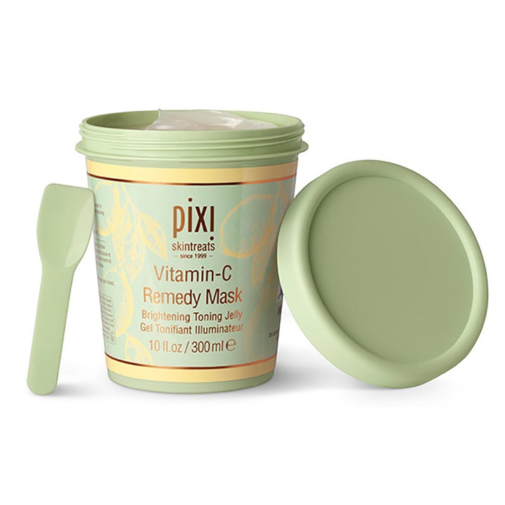 Pixi Vitamin-C Remedy Mask 300 ml kirkastava kasvonaamio vihreässä purkissa levityslastan ja avatun kannen kera.