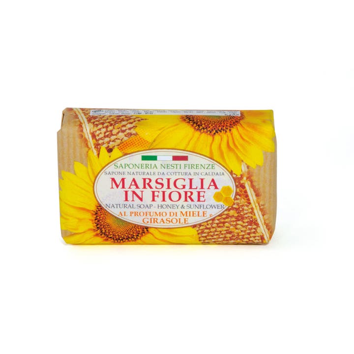 Nesti Dante Marsiglia in Fiore Honey & Sunflower hoitava palasaippua keltaisilla auringonkukilla ja hunajakennoilla.