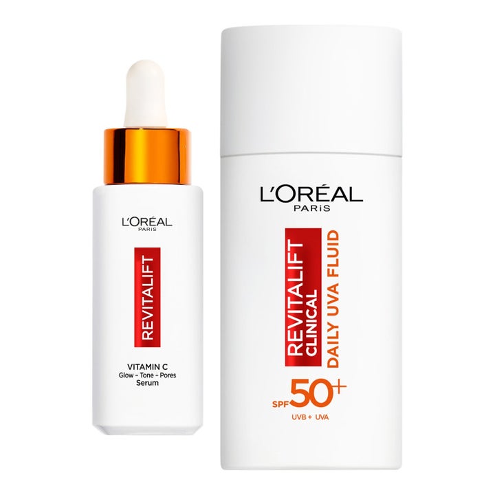L'Oréal Paris Revitalift Clinical heleyttävä C-vitamiiniseerumi ja SPF 50+ aurinkosuoja valkoisissa pulloissa