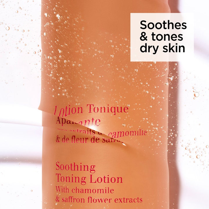 Clarins Soothing Toning Lotion 200 ml rauhoittava kasvovesi oranssissa pullossa jossa on ilmakuplia.