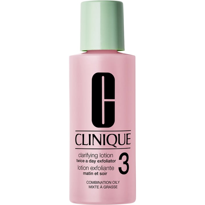 Clinique Clarifying Lotion 3 kuoriva kasvovesi kirkastaa ihoa vaaleanpunaisessa pullossa vihreällä korkilla.