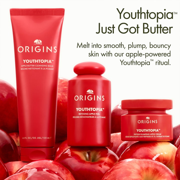 Origins Youthtopia Apple Butter Cleansing Balm 125 ml puhdistava kasvojenpuhdistus punaisessa tuubissa omenoiden keskellä