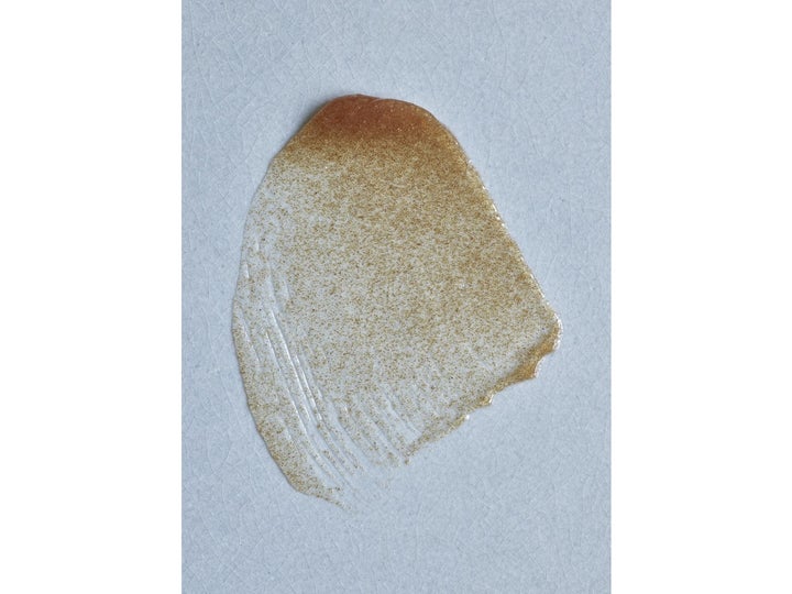 Rudolph Care Acai Body Scrub 200 ml vartalokuorinta, jonka rakeinen ja öljyinen koostumus näkyy sivelynä.
