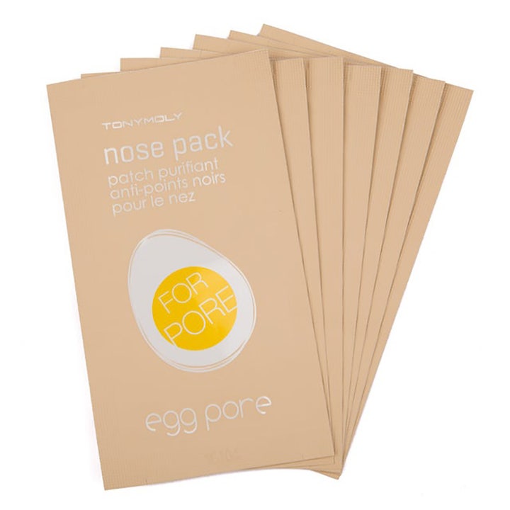 Tonymoly Egg Pore Nose Pack 7 kpl puhdistava nenämaski poistaa mustapäitä beigeissä pusseissa joissa muna-grafiikka.