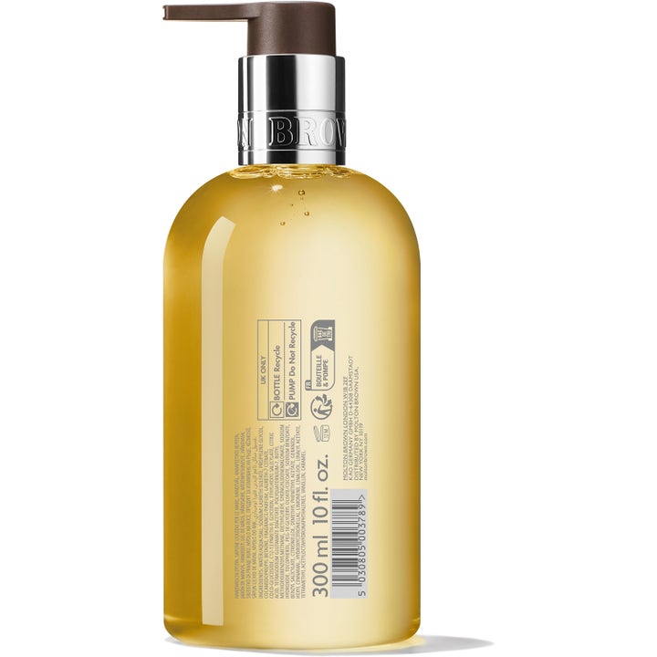 Molton Brown Flora Luminare Fine Liquid Hand Wash 300 ml käsisaippua keltaisessa pullossa ainesosatiedoin ja hopeapumpulla.